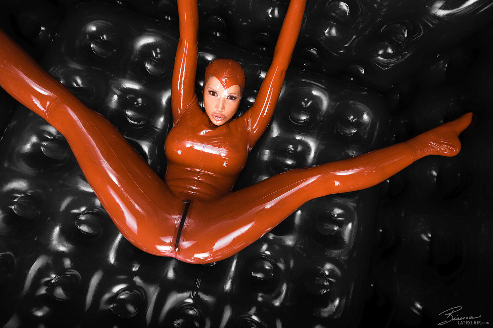 bianca_beauchamp breasts catsuit female gloves large_breasts latex long_hair red_hair solo watermark