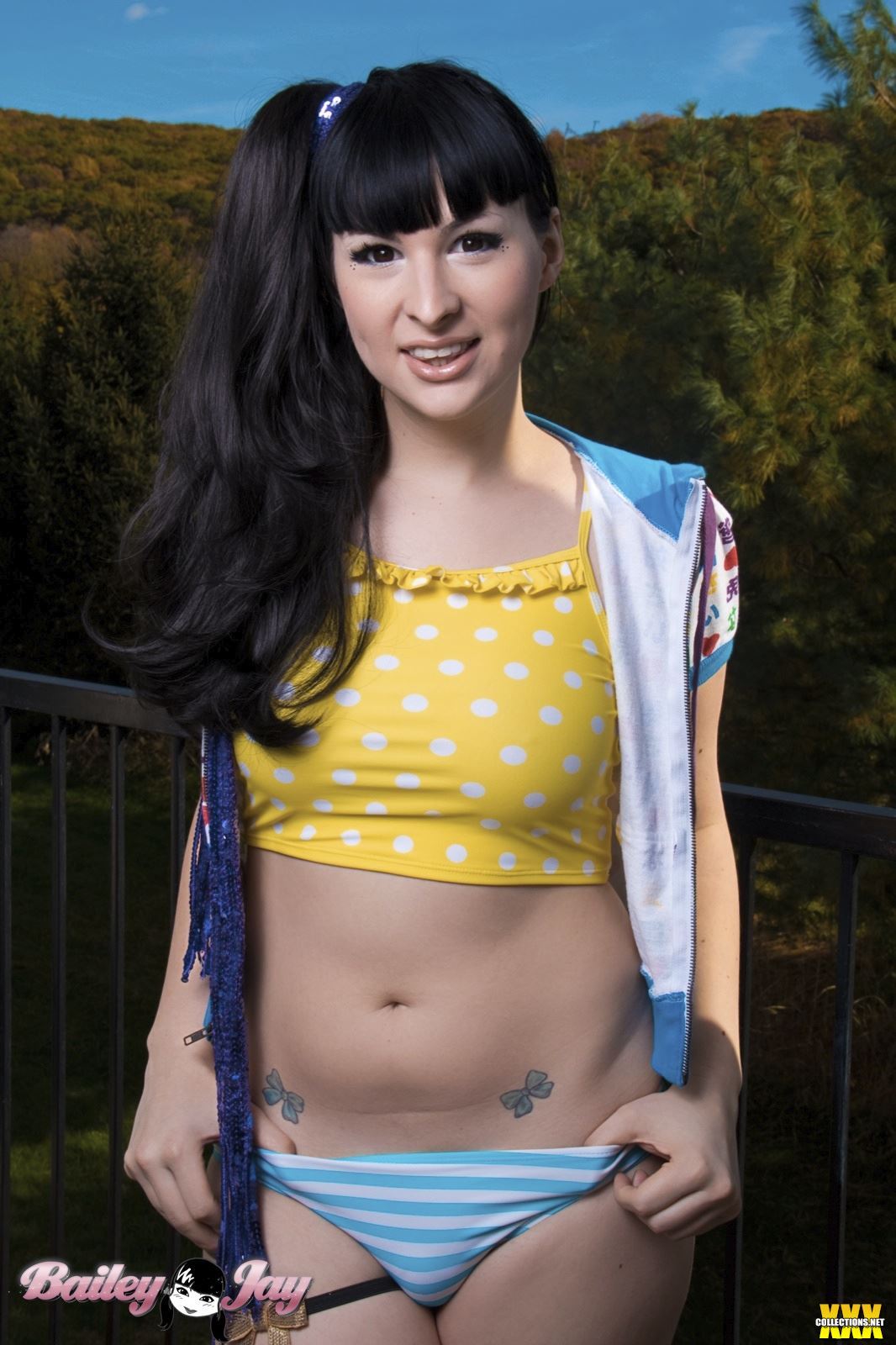 bailey_jay black_hair breasts large_breasts long_hair navel outside ponytail shemale solo tattoo watermark