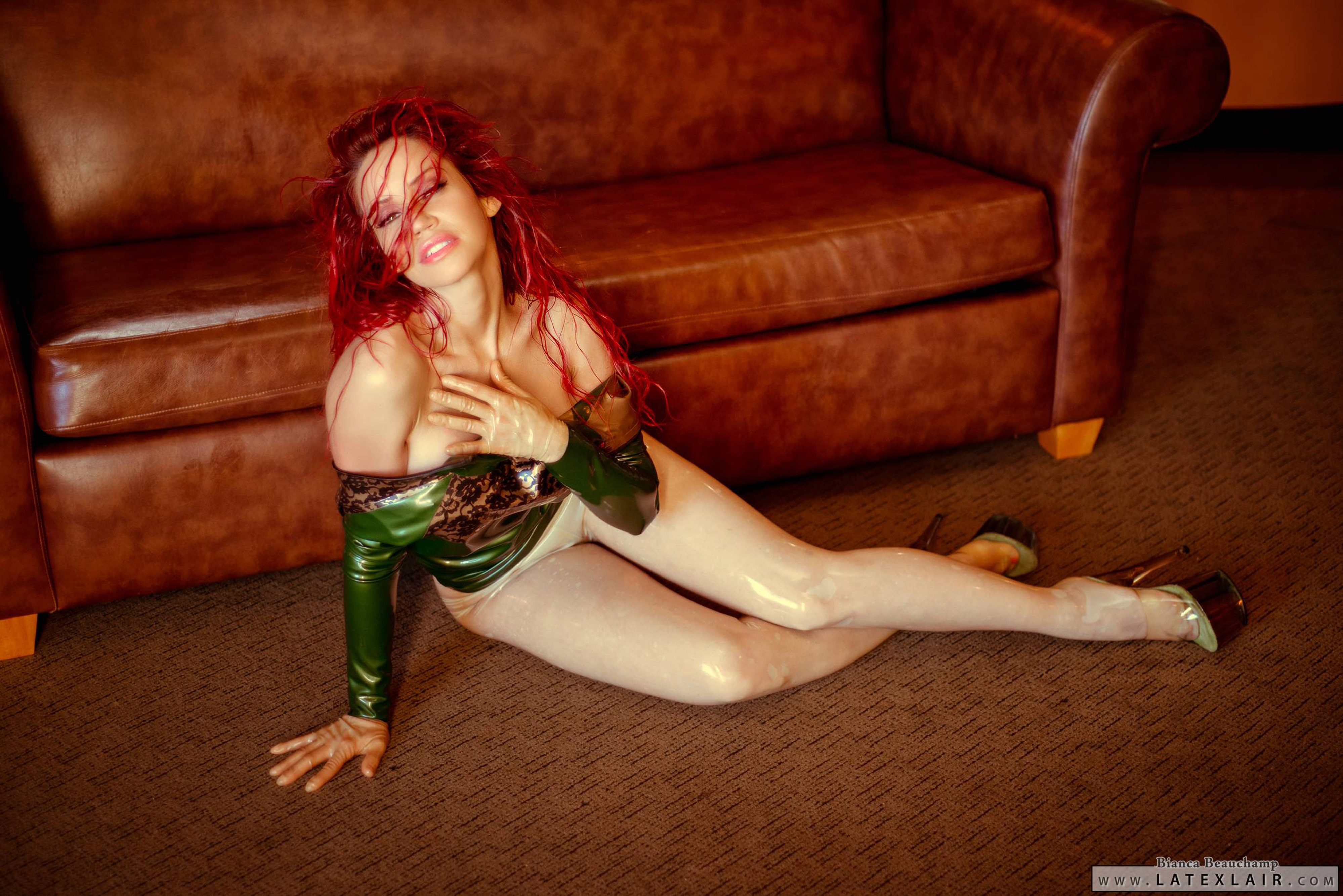 bianca_beauchamp breasts dress female high_heels large_breasts latex long_hair red_hair shoes sofa solo watermark