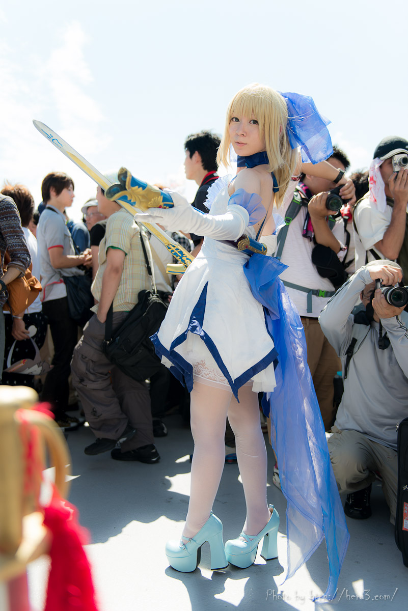 1girl asian blonde_hair breasts cosplay dress fate_(series) high_heels long_hair outside saber sword