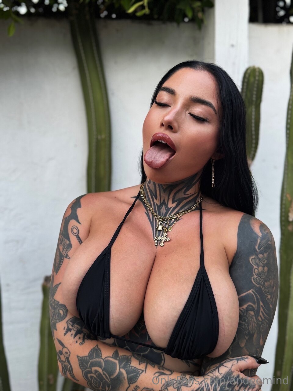 1girl andeemind big_breasts black_hair bra breasts cleavage ear_piercing earrings eyes_closed fake_nails female female_focus female_only female_solo lipstick long_hair makeup necklace onlyfans open_mouth piercing selfie solo tattoo text tongue tongue_out watermark