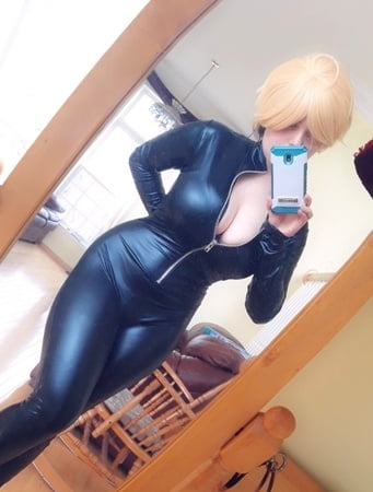 1girl big_tits blonde_wig cosplay mirror non_nude selfie skin_tight unzipped virescence