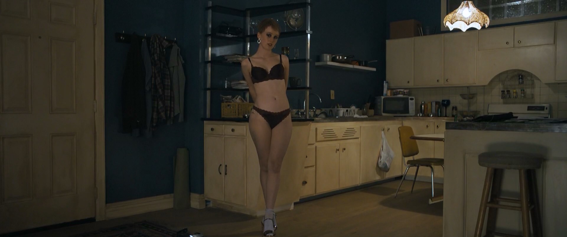 absurdres acting actress arms_behind back bare_shoulders beautiful_woman bobbi_salv&ouml;r menuez cleavage collarbone crossed_legs earrings femsub film highres kitchen large_breasts large_tits lingerie living_room male_pov navel orange_hair prostitute red_lipstick screenshot shooting-star_#1 short_hair standing strut strutting unbothered uncaring under_the silver lake walking walking_towards viewer wide_hips