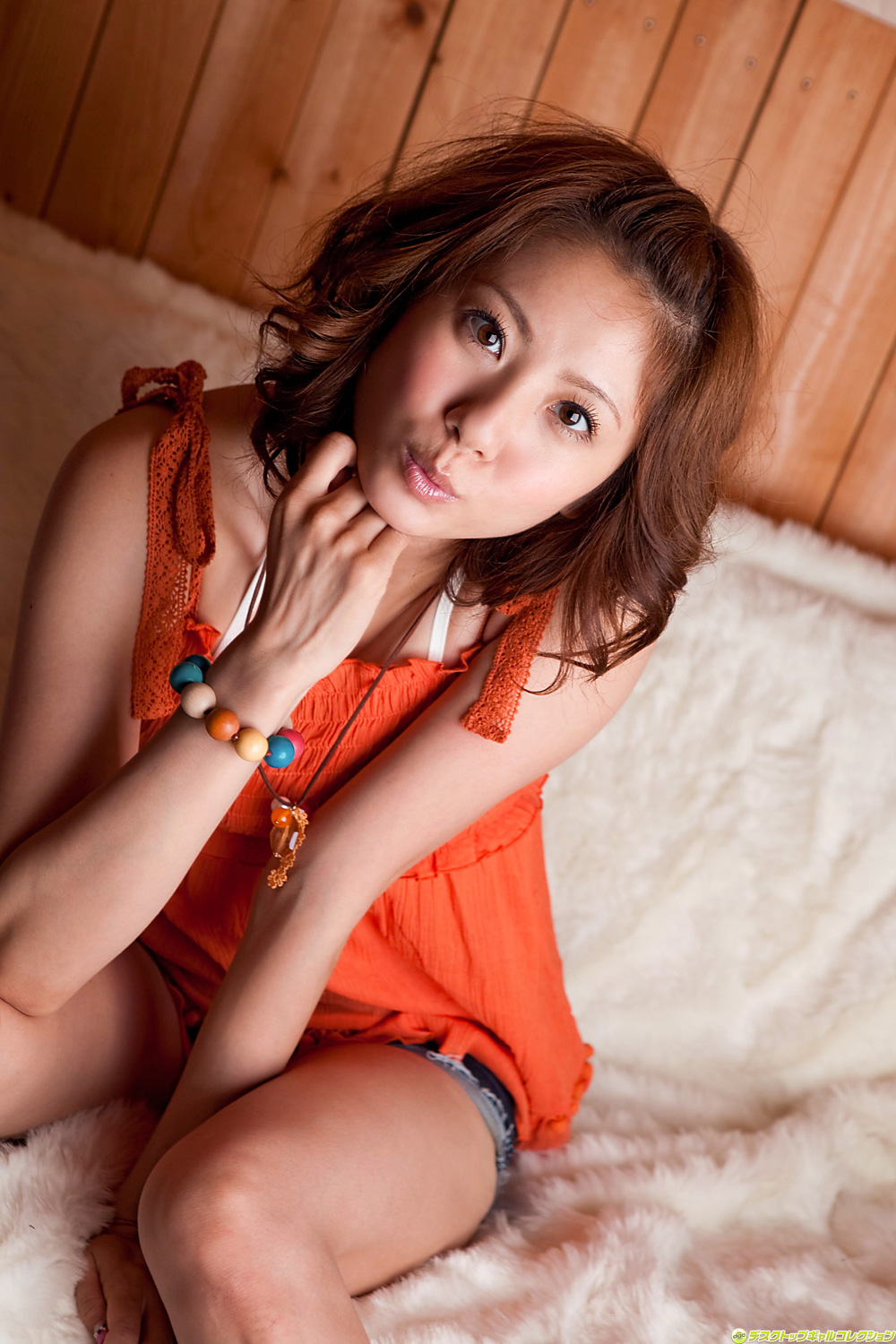 1girl asami_yuma asian breasts brown_hair clothed denim female female_only large_breasts long_hair looking_at_viewer non-nude pornstar pursed_lips short_shorts sitting solo