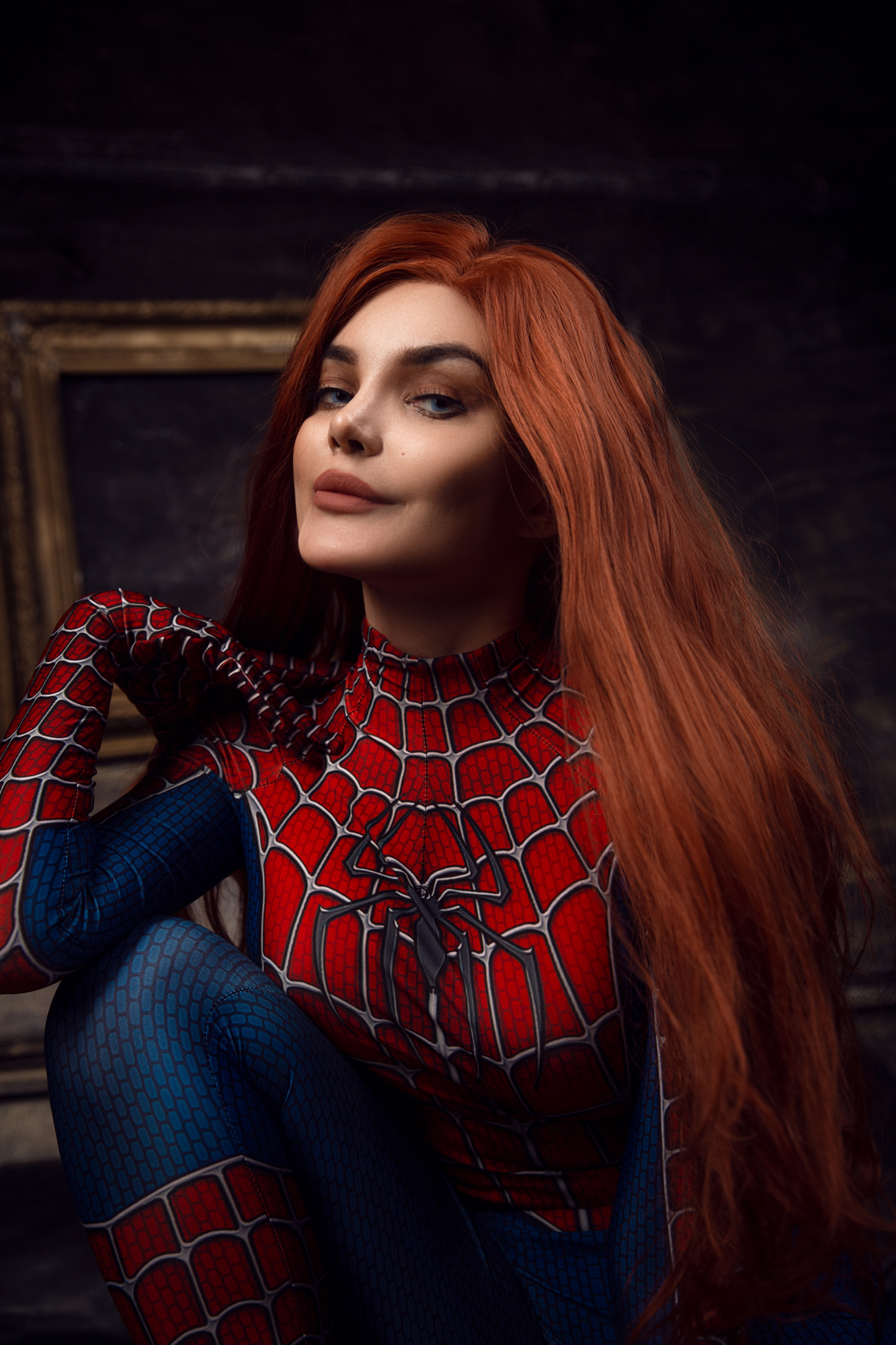 1girl cosplay female female_only kalinkafox marvel red_hair smile sofa solo spider-man spider-man_(series) tagme