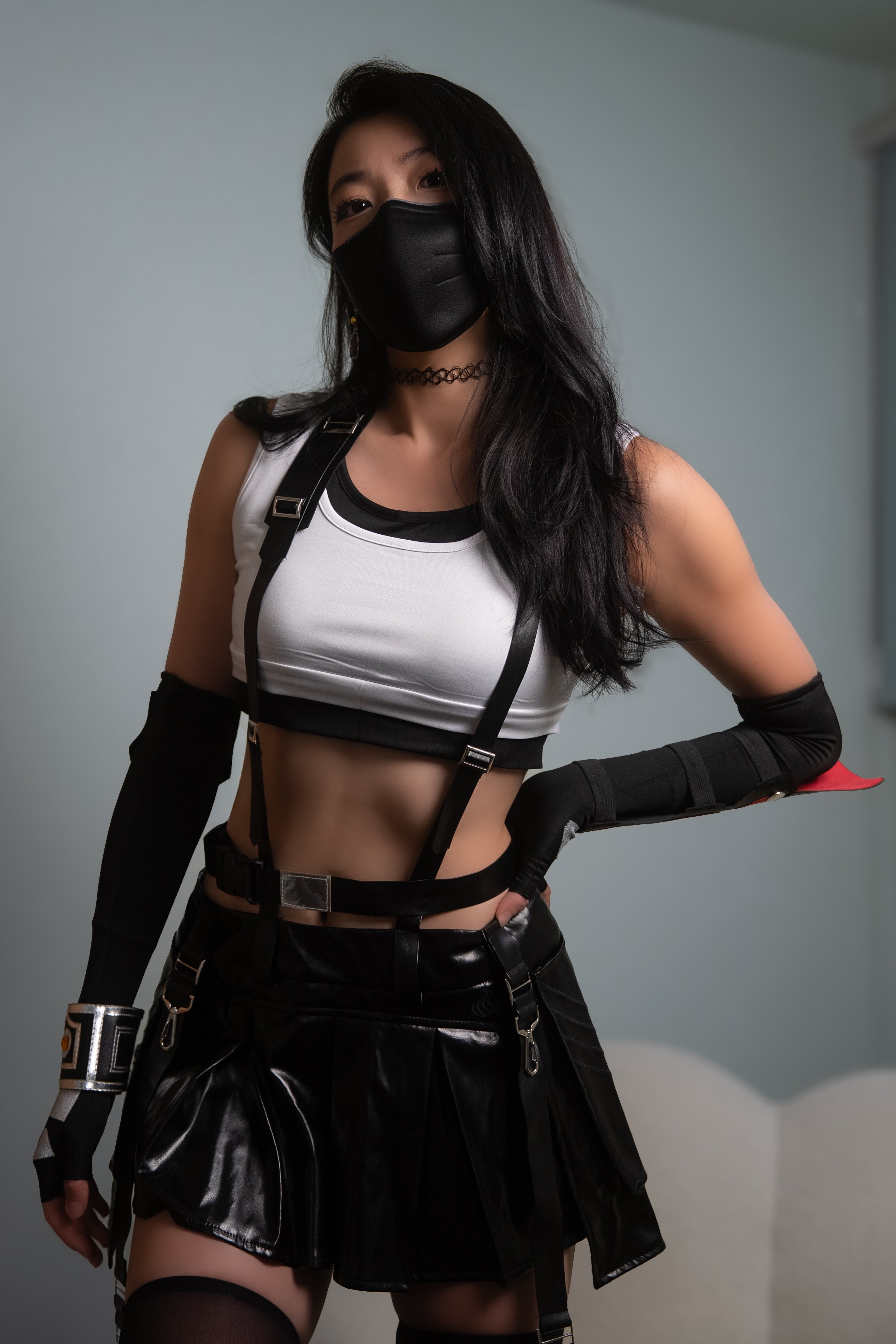 1girl asian black_hair cosplay facemask female fingerless_gloves long_hair midriff onigiri skirt small_breasts thick_thighs thighhighs thighs tifa_lockhart virtual_youtuber vtuber