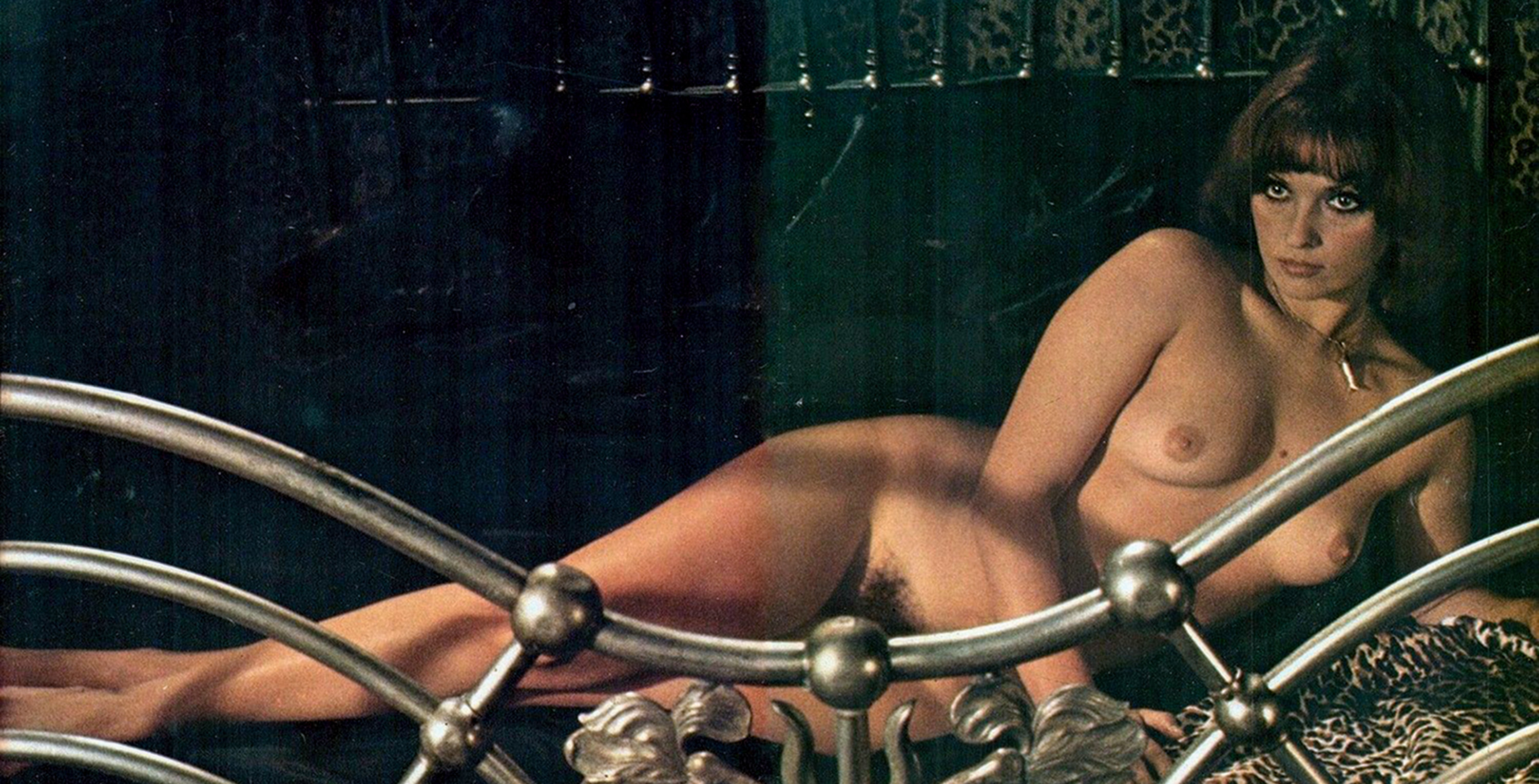 1970s absurdres actress bare_shoulders brown_eyes brown_hair character_request cleavage collarbone copyright_request crossed_legs erect_nipples femi_benussi highres large_breasts large_tits model modeling navel posing short_hair wide_hips