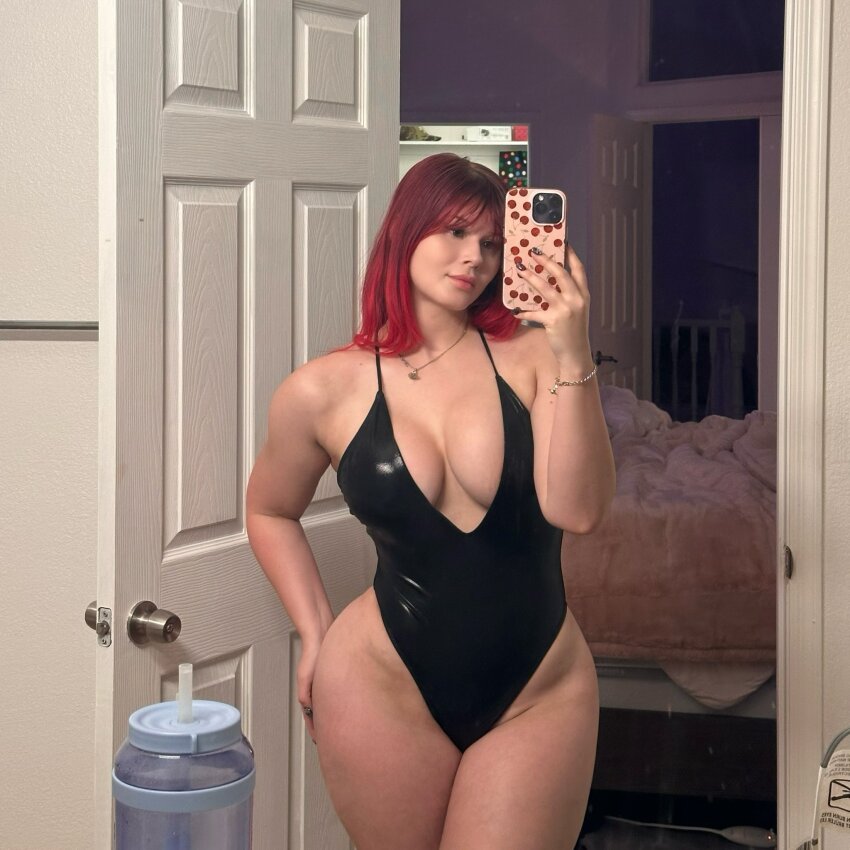 1girl bikini breasts large_breasts medium_hair mirror mirror_selfie one-piece_swimsuit red_hair selfie solo swimsuit twitter