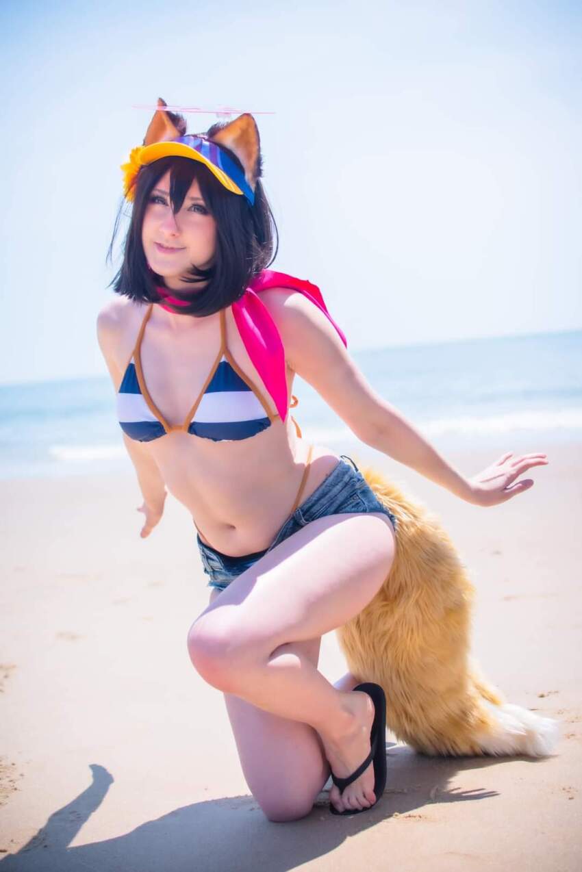 1girl beach bikini bikini_bottom bikini_top blue_archive cosplay cosplayer denim_shorts flip_flops izuna_(blue_archive) mangoloo sand sandals short_shorts striped_bikini tail water white_female