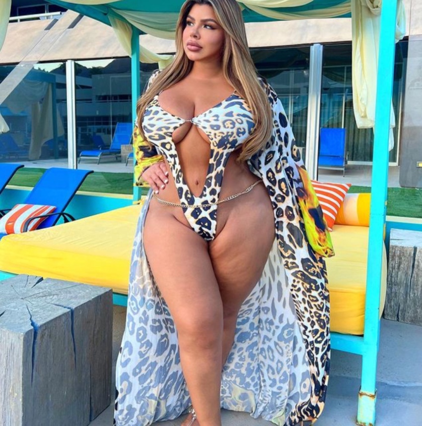 1girl amateur bbw big_breasts bikini blonde_hair breasts chubby curvy fake_lips female female_only hand_on_hip huge_breasts instagram latina milf navel non-nude open_robe outdoors parted_lips posing shell_raven sling_bikini solo sourced standing stomach tan_skin thick thick_thighs wide_hips