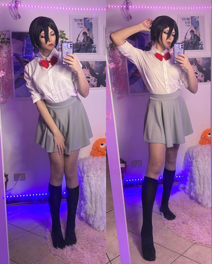 1girl black_hair bleach cellphone cosplay highres kuchiki_rukia kuchiki_rukia_(cosplay) legs long_legs miniskirt phone real_life school_uniform selfie short_hair skirt solo