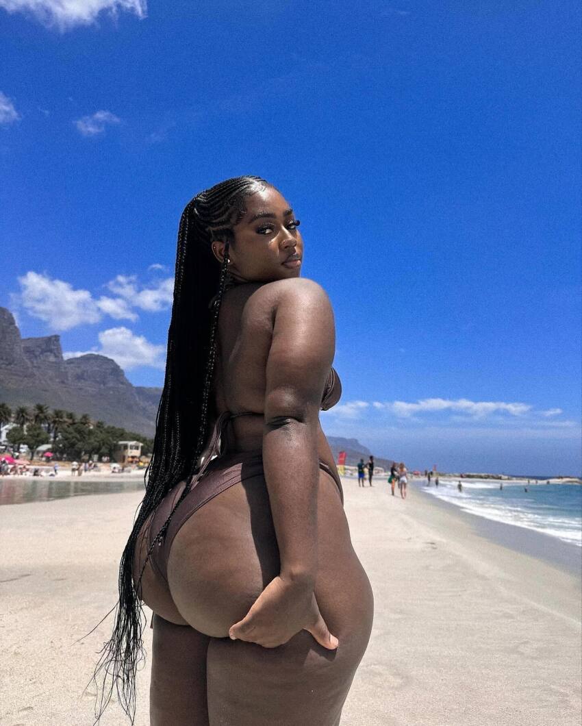 1girl ass ass_focus beach bikini black black_female clothed clothed_female dark-skinned_female dark_skin female female_focus female_only female_solo long_hair looking_back solo solo_female solo_focus