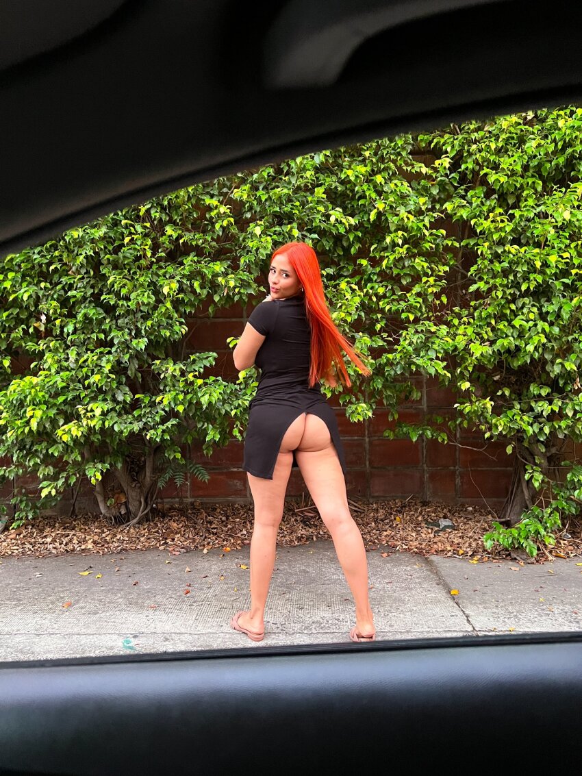 ass_eating_clothing ass_flash ass_focus black_dress car_interior female female_focus female_only ginger katyflynn kissy_face latina long_hair looking_at_viewer looking_back solo tan_skin