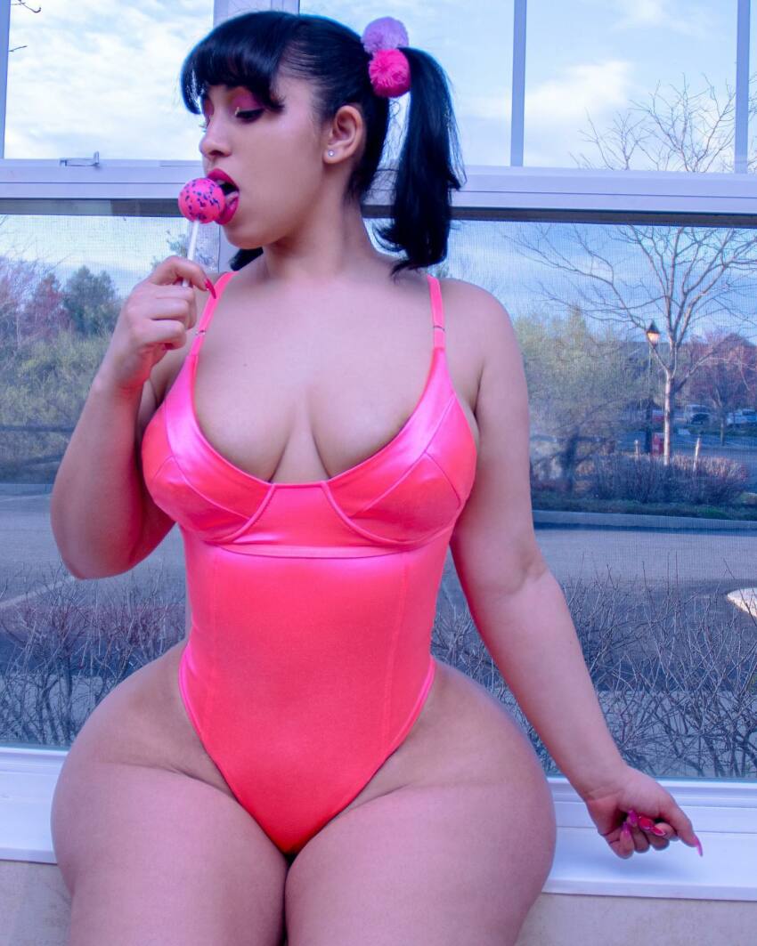 1girl ass bangs big_ass bimbo breasts candy closed_eyes clothed cute earrings eyeshadow female female_only hair_clip hispanic huge_ass instagram large_ass latina leotard lipstick lollipop long_nails medium_breasts natural_breasts pink_leotard pink_nails short_hair sitting solo stephanie_rodriguez twintails wide_ass wide_hips