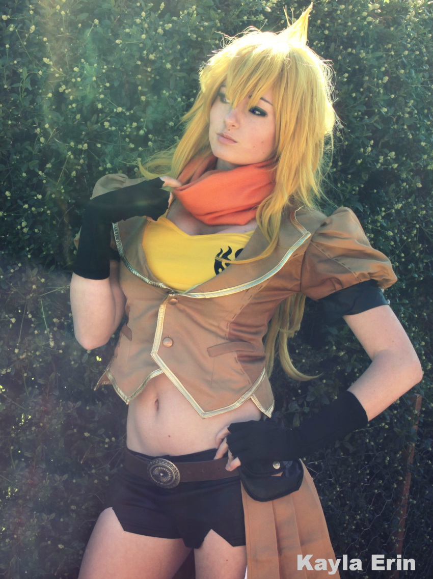 1girl blonde_hair breasts cleavage cosplay female hotpants kayla_erin large_breasts long_hair midriff navel outside rwby shorts solo yang_xiao_long