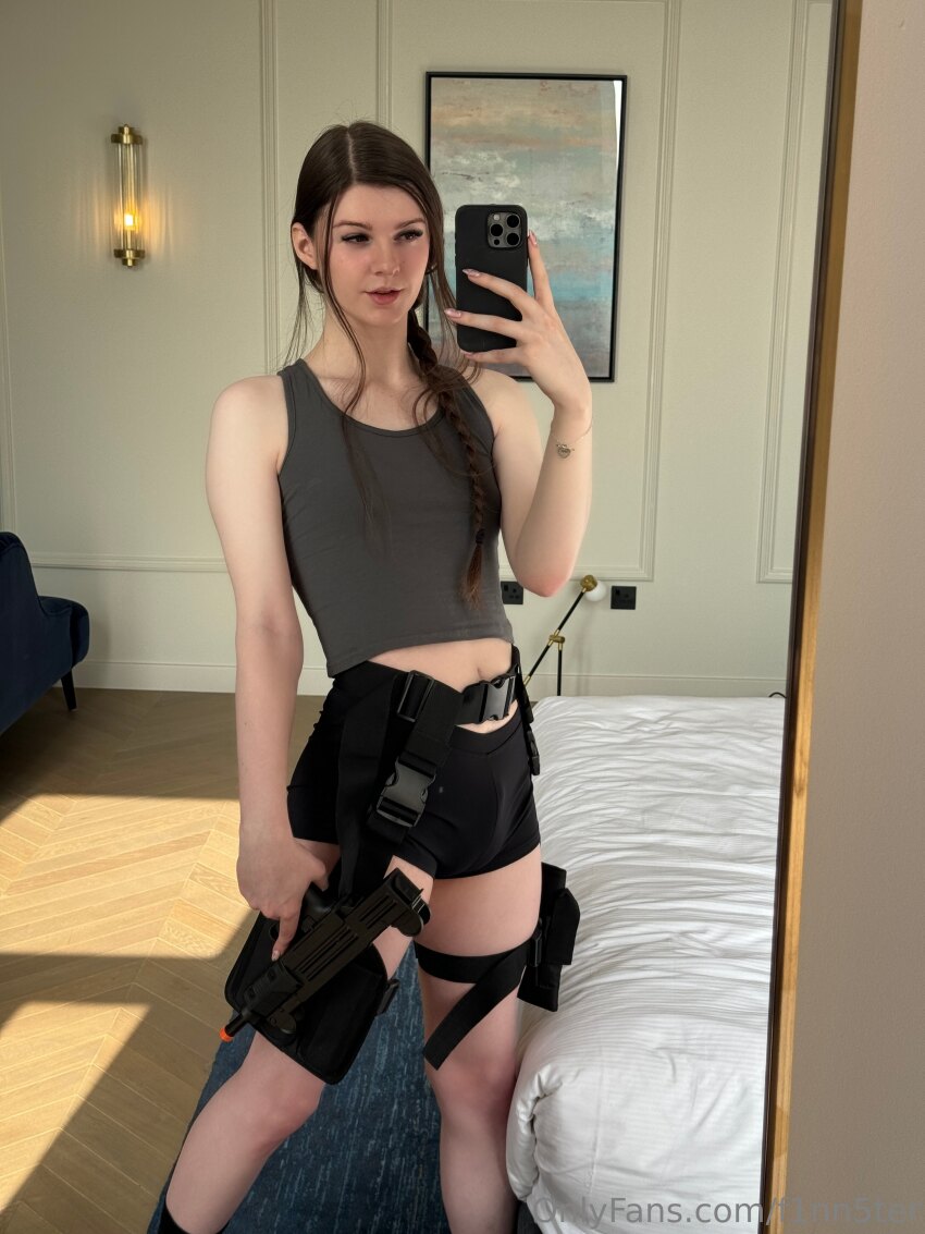 braid brown_hair bulge clothed cosplay f1nn5ter fake_nails femboy lara_croft long_hair midriff mirror non-nude onlyfans phone reflection selfie short_shorts smartphone solo tank_top tattoo tight_fit tomb_raider transgender trap watermark white