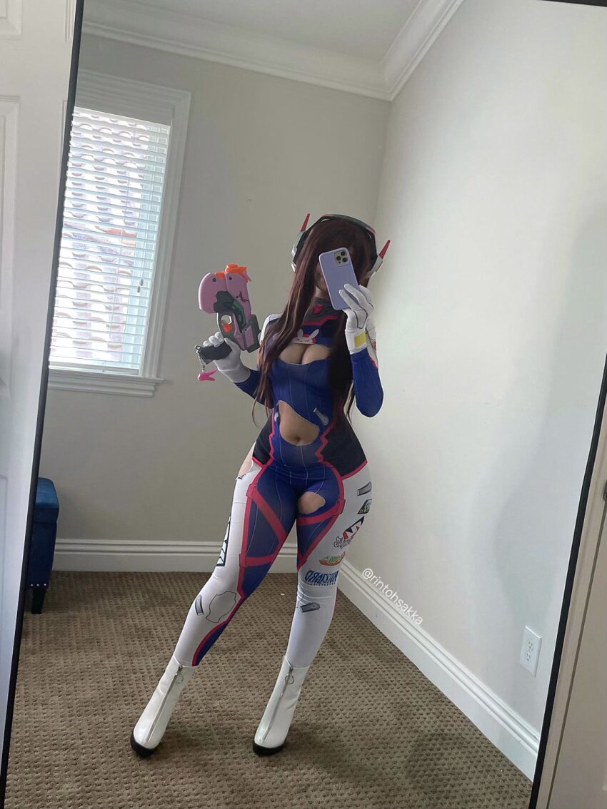 1girl belly belly_button bodysuit boots brunette cleavage cleavage_cutout cosplay d.va d.va_(cosplay) form_fitting gun mirror mirror_selfie overwatch revealing_clothes rintohsakka ripped_clothes seflie selfie skin_tight solo solo_female solo_focus straight_hair torn_clothes