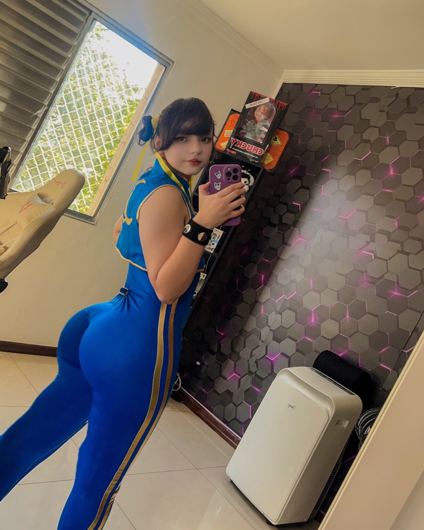 1girl ass brown_hair chun-li clothed clothed_female cosplay female female_focus female_only female_solo long_hair looking_back solo solo_female solo_focus sophia_scamander street_fighter