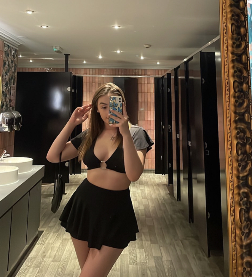 18 bathroom cleavage mirror mirror_selfie photo public public_bathroom samantha selfie skirt small_breasts smartphone