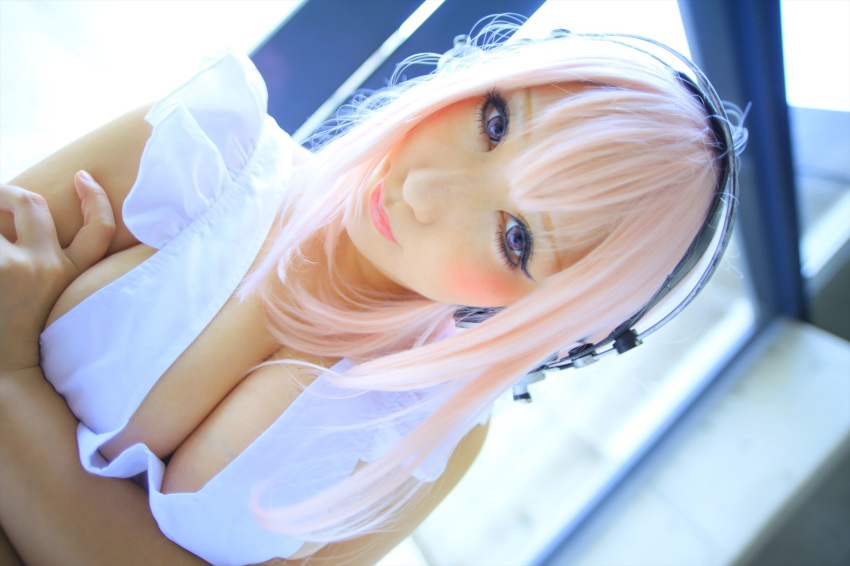 1girl asian breasts cosplay female headphones japanese large_breasts long_hair pink_hair shooting_star solo super_sonico