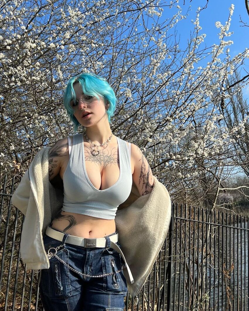 1girl blue_hair cleavage clothed_female glasses instagram jeans lyracr0w0 navel pale_skin short_hair sourced tagme tattoo tattooed_girl tree