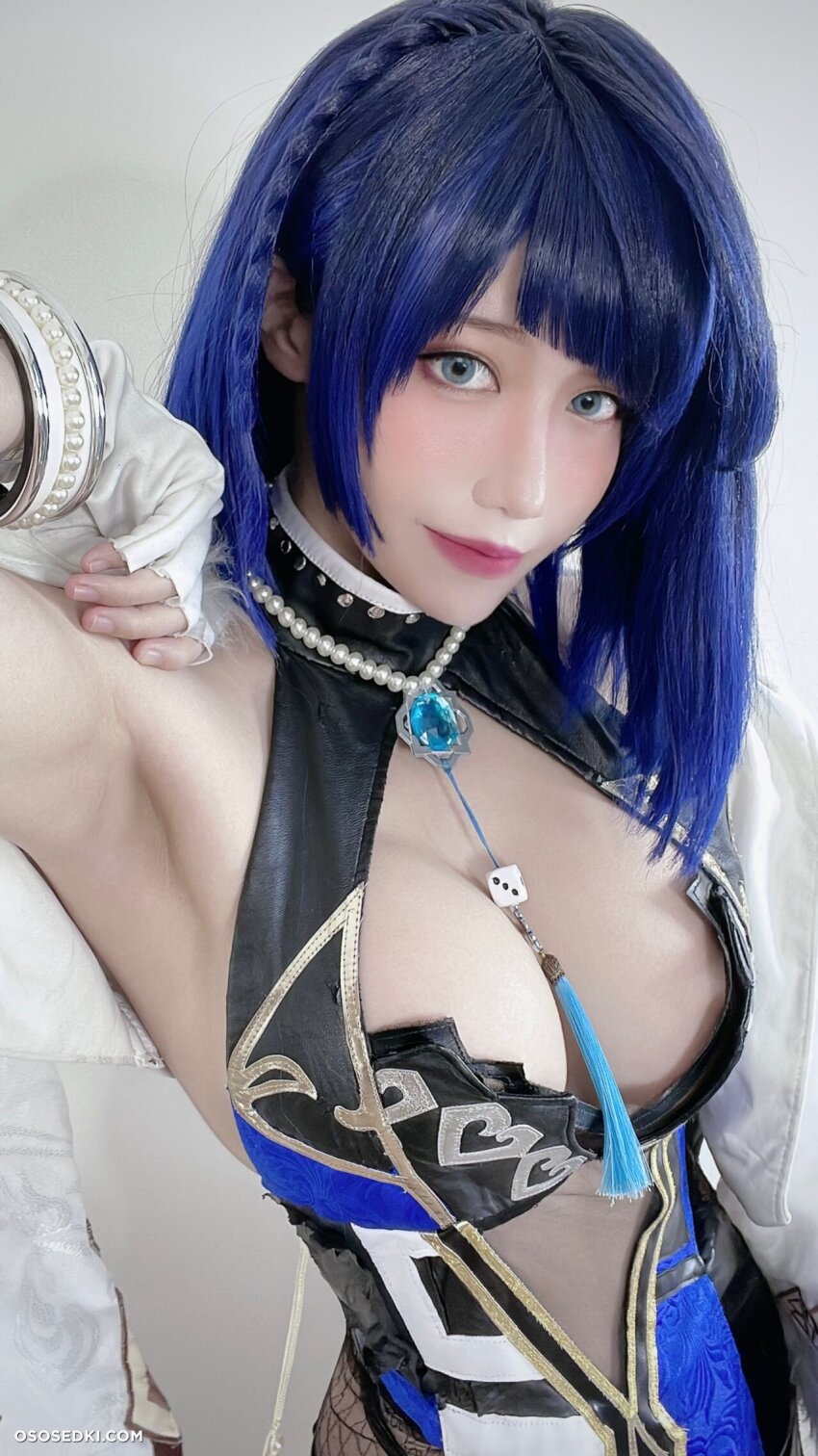 1girl ain_nguyen armpits asian blue_hair cleavage cosplay female genshin_impact large_breasts short_hair solo vietnamese yelan_(genshin_impact)