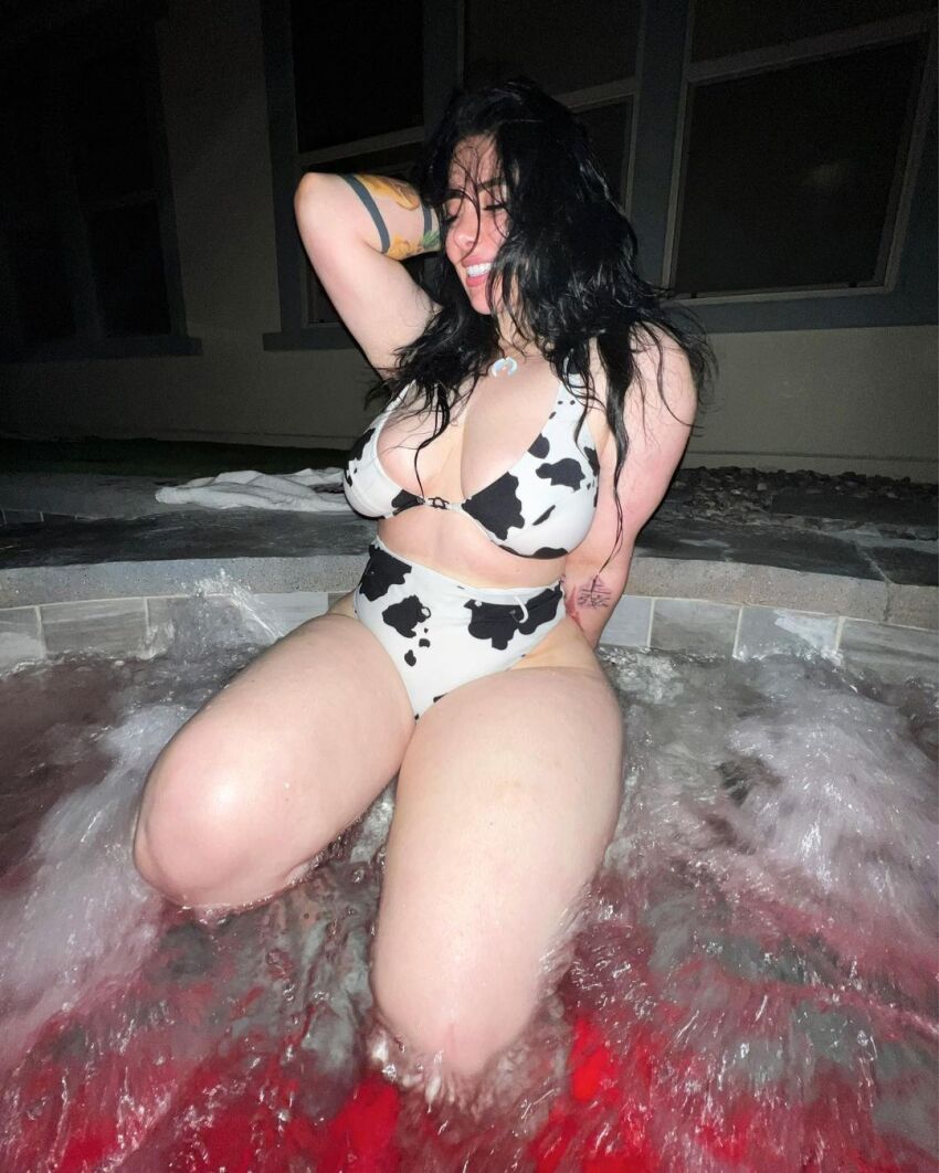 1girl bikini black_hair cleavage cow_print cow_print_bikini eyes_closed hot_tub momokun smile solo tattoo