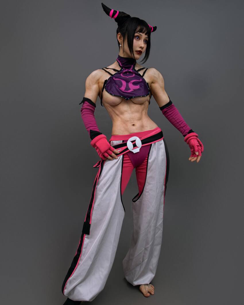 1girl abs asian bangs belt black_hair breasts capcom chinese cosplay detached_sleeves earrings fake_breasts feet female female_only fingerless_gloves gloves grey_background hair_horns halterneck hand_on_hip instagram juri_han large_breasts lipstick midriff muscle muscular_female navel pants red_lipstick sidelocks simple_background solo standing street_fighter toeless_socks toes underboob yuan_herong