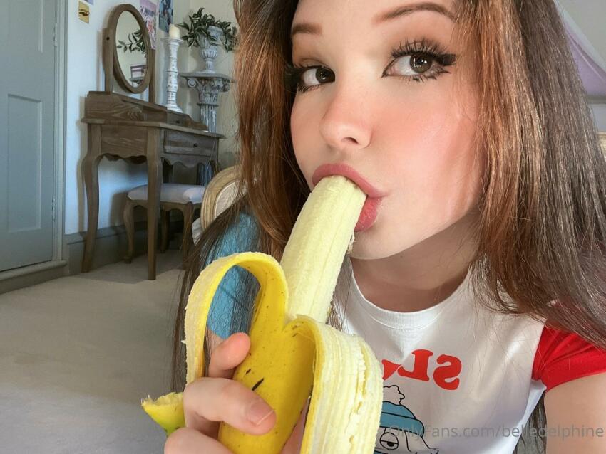 1girl 2022 banana banana_in_mouth belle_delphine brown_hair eating eyes female female_focus female_only female_solo food leaked leaked_nudes onlyfans oral_insertion oral_insinuation phallic selfie sfw solo suggestive suggestive_food t-shirt watermark