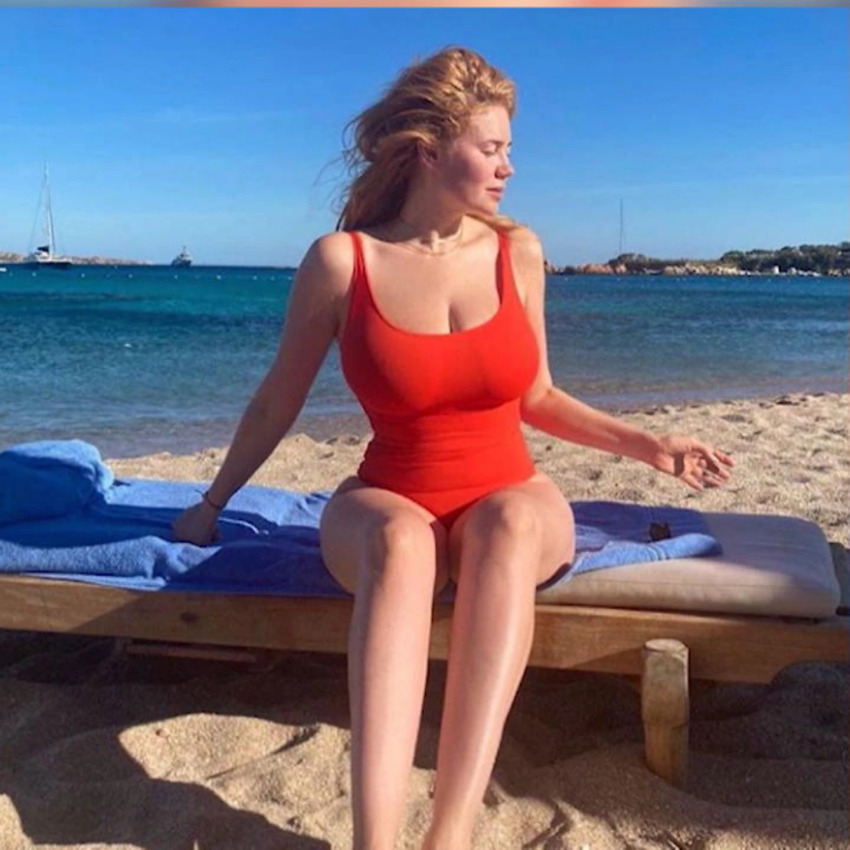 beach big_tits boobs breasts celebrity cleavage curvy german huge_breasts large_breasts legs long_hair orange_hair outdoors outside palina_rojinski red_hair redhead russian sand swimsuit thick tits tv_host water