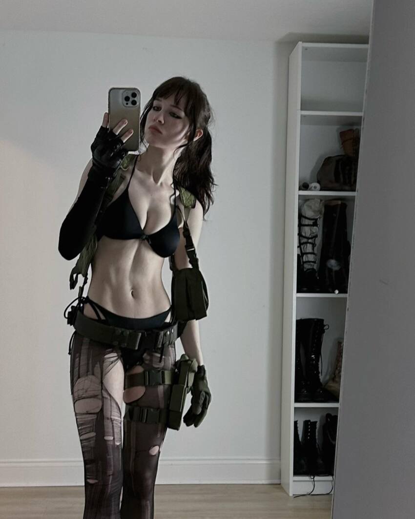 1girl bikini cleavage clothed clothed_female cosplay instagram mirror non-nude norafawn photo quiet_(metal_gear) selfie solo solo_female solo_focus sourced