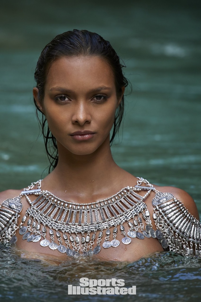 1girl brown_skin female female_focus lais_ribeiro latina looking_at_viewer outdoors shiny_skin solo solo_focus sports_illustrated tan water watermark