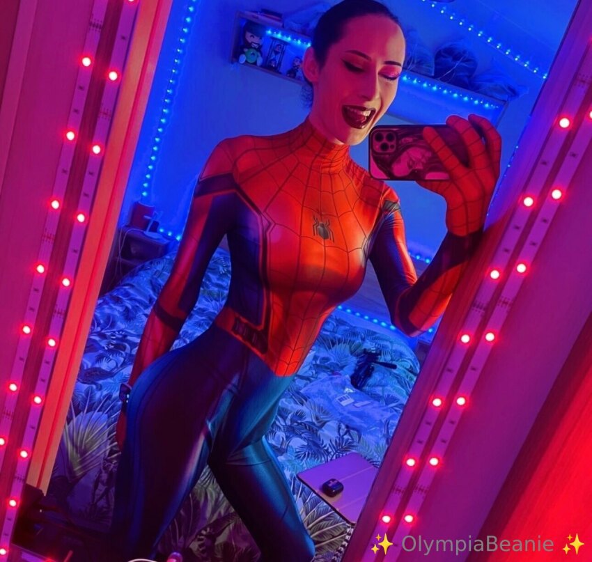 1shemale bedroom bodysuit cosplay indoors olympiaof selfie small_breasts smile solo spider-man spider-man_(series) spiderman transgender