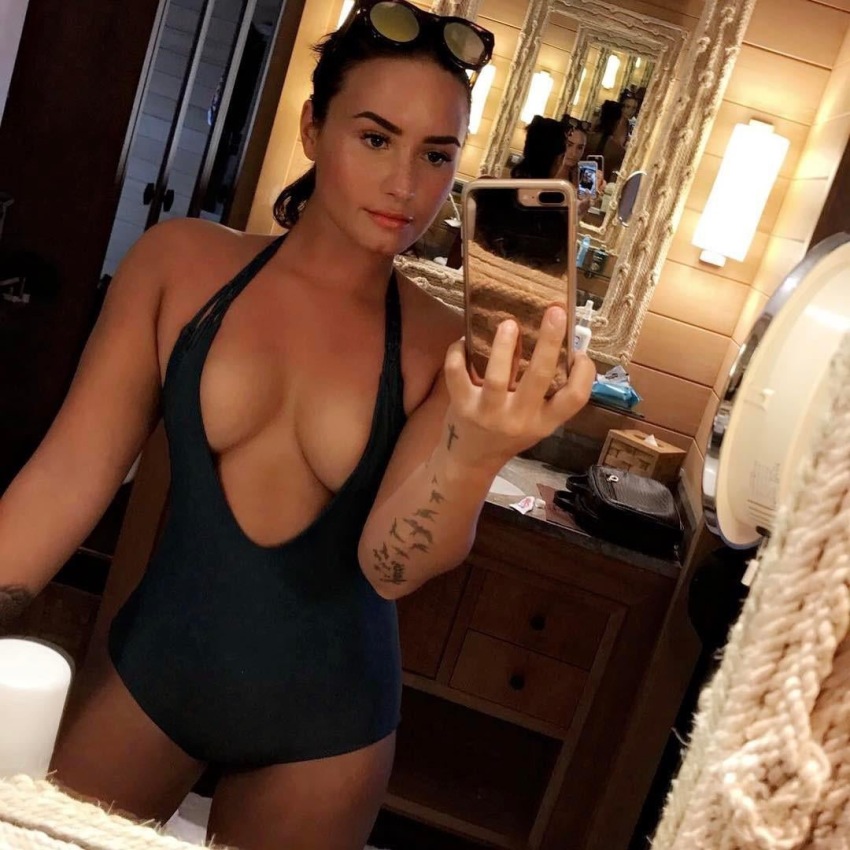 1girl bikini celebrity cleavage clothed demi_lovato female_only medium_breasts mirror_selfie selfie singer sunglasses sunglasses_on_head