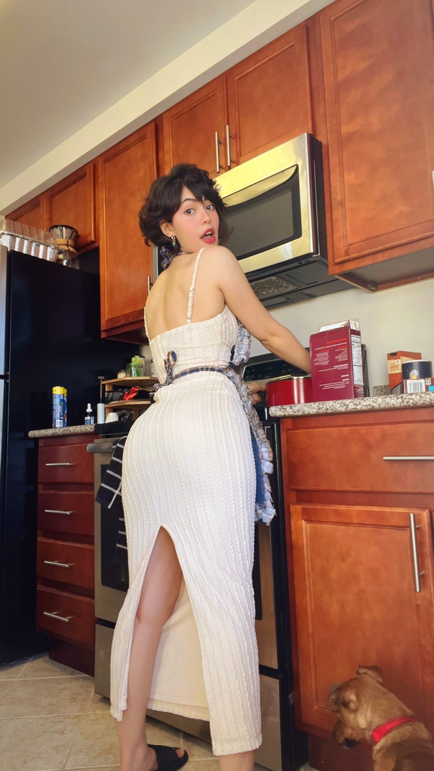 1girl apron ass ass_focus back_view backless_dress backside betas_inferno black_hair brown_eyes butt cooking dark_hair dress dress_slit edited female female_focus female_only female_solo from_behind indoor indoors inside kitchen light-skinned_female light_skin looking_at_camera looking_at_the_viewer looking_at_viewer looking_at_you looking_back looking_over_shoulder sandals single_female solo solo_female solo_focus solo_girl sourced standing white_dress