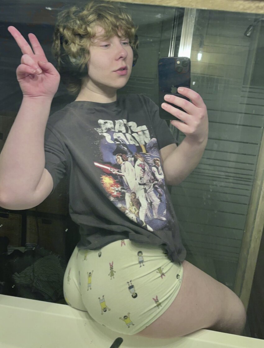 1boy booty booty_shorts clothed clothed_male cupid female_focus headphones male_only mirror_selfie peace_sign short_shorts shorts sitting_on_sink solo solo_male thighs