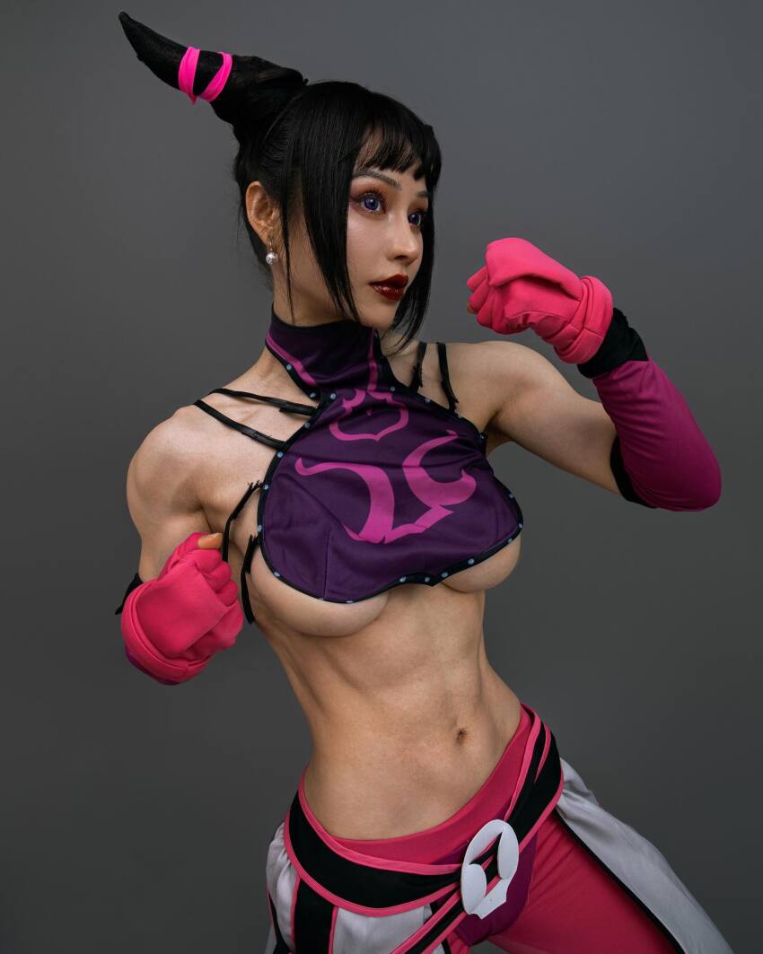 1girl abs asian bangs belt breasts capcom chinese clothed cosplay detached_sleeves earrings fake_breasts female female_only fighting_stance fingerless_gloves gloves grey_background hair_horns halterneck instagram juri_han large_breasts midriff muscle muscular_female navel pants sidelocks simple_background solo street_fighter underboob yuan_herong