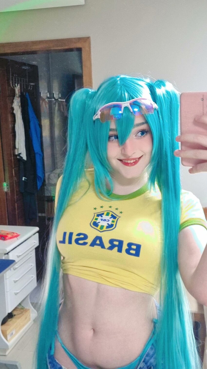 1girl blue_hair brazilian_miku brazilian_miku_(cosplay) cosplay hatsune_miku hatsune_miku_(cosplay) highres jeans_shorts long_hair panties real_life selfie shorts smile solo underwear very_long_hair