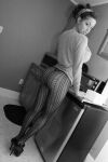 1girl ass clothed dat_ass female female_only from_behind greyscale hair_up high_heels kitchen leggings looking_at_viewer looking_back monochrome non-nude parted_lips skin_tight solo solo_female standing tight_fit rating:Explicit score:8 user:RB