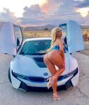1girl ass bimbo blonde car caucasian dat_ass from_behind high_heels hips legs looking_at_viewer looking_back milf nicolette_shea non-nude outdoors porn_star posing sexy standing swimsuit thick_thighs rating:Questionable score:6 user:Tall_one