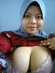 1girl big_breasts blue_wall bra cleavage female female_only front_view hijab looking_at_viewer muslim non_nude pink_bra red_shirt ring shirt shirt_lift smile solo solo_female tits upper_body rating:Explicit score:16 user:Muslimboy38