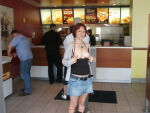 1girl belt black_top breasts breasts_out british exhibitionism exposed_breasts fast_food female flashing green_eyes indoors jeans_skirt kfc looking_at_viewer medium_breasts necklace nipples public red_hair skirt smile solo_focus studded_belt rating:Explicit score:3 user:xGoodx