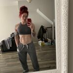 1girl abs arm_tattoo female muscular_female natasha_aughey red_hair shoulder_tattoo sweatpants tattoo rating:Explicit score:14 user:Cryptologically
