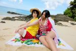 2girls asian beach black_hair boa_hancock breasts chouzuki_maryou cleavage cosplay earrings female female_only high_heels huge_breasts long_hair midriff monkey_d._luffy multiple_girls navel one_piece sand shoes water rating:Explicit score:1 user:RB