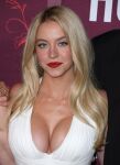 1girl actress big_breasts blonde blonde_hair breasts celebrity cleavage female female_focus female_only female_solo lipstick long_hair looking_at viewer makeup ring solo sydney_sweeney white_female