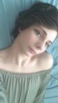 abkazias bare_shoulders clothed dark_hair looking_at viewer non-nude on_back on_bed pornstar solo transgender white zelda_cross