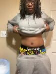 1girl belly_chub black_female breasts_out dreadlocks female female_focus female_only fondling_breasts glasses grey_clothing hoodie hoodie_lift lesbian lkmett sagging_pants shirt_lift shorter_than 30 seconds solo sound stud tagme video