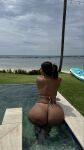 1girl ass big_ass bikini brown_hair clothed clothed_female female female_focus female_only graciebon huge_ass long_hair looking_back partially_clothed solo solo_female solo_focus water