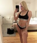 1girl amateur bedroom blacked_clothing blonde_hair blue_eyes bracelet light-skinned_female mirror mirror_selfie necklace selfie snwbnnyclaire sports_bra tan_skin tanned thong