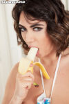 1girl apron banana banana_in mouth closeup female female_only looking_at viewer luna_amor scoreland solo watermark white